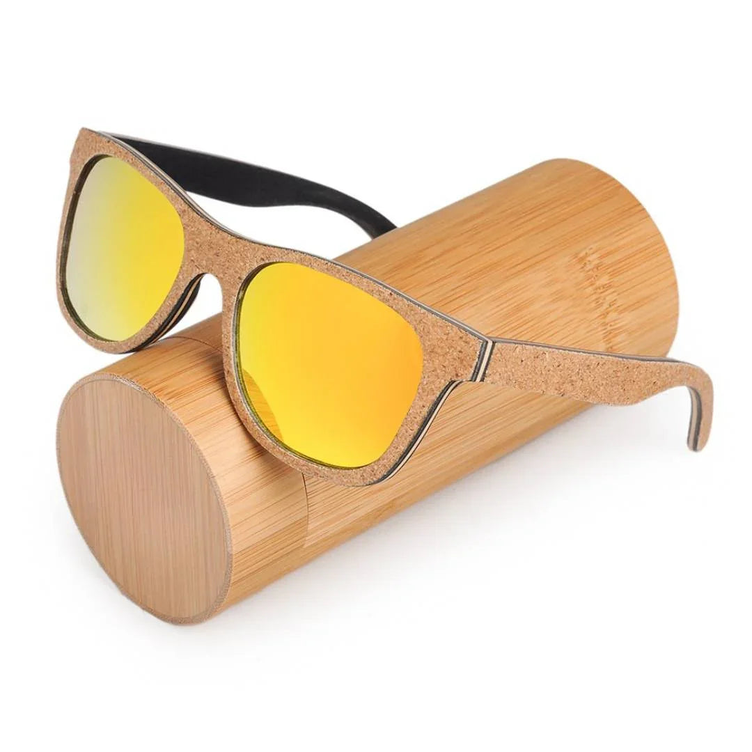 Yellow mirrored cork sunglasses on a round bamboo case, eco-friendly eyewear