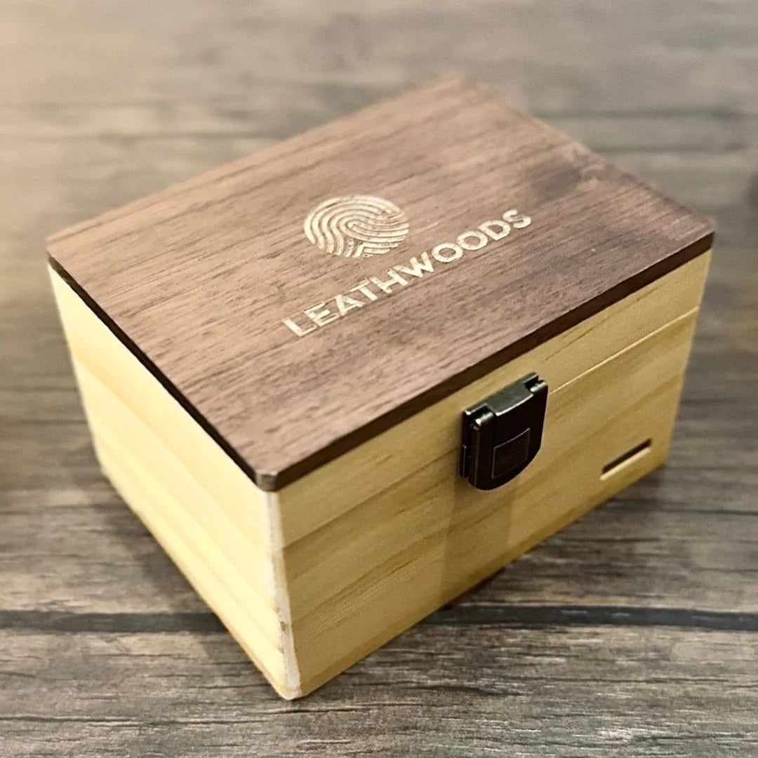 Leathwoods wooden keepsake box with engraved lid and latch on rustic wood table