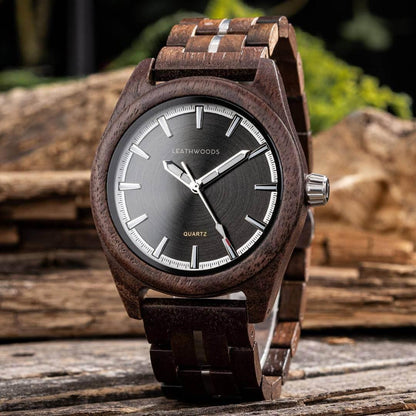 LEATHWOODS quartz wristwatch with wooden band and black dial on rustic wooden surface