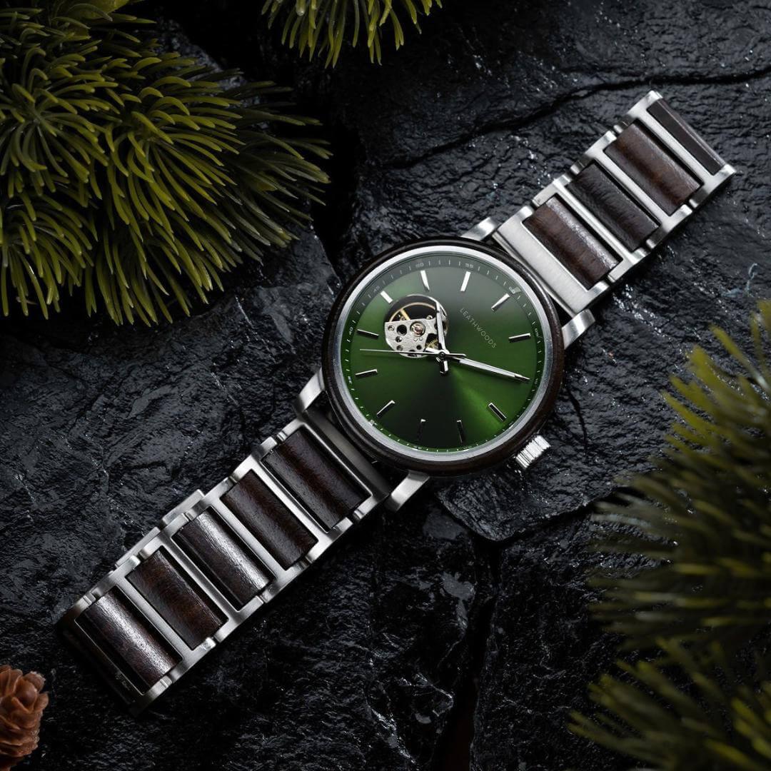 Leatherwoods men's wristwatch with green dial and wood-accented metal band on black stone