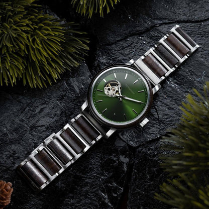 Leatherwoods men's wristwatch with green dial and wood-accented metal band on black stone