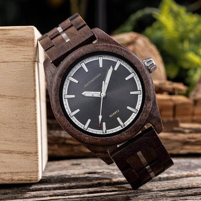 Wooden Leathwoods quartz wristwatch with dark face and silver markers on rustic wooden background