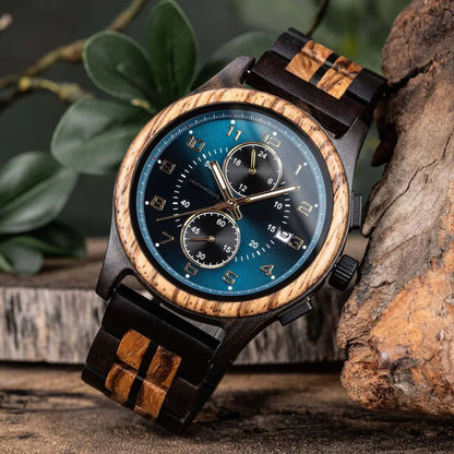 Men's wooden wristwatch with blue dial and chronograph, rustic background, plant decor