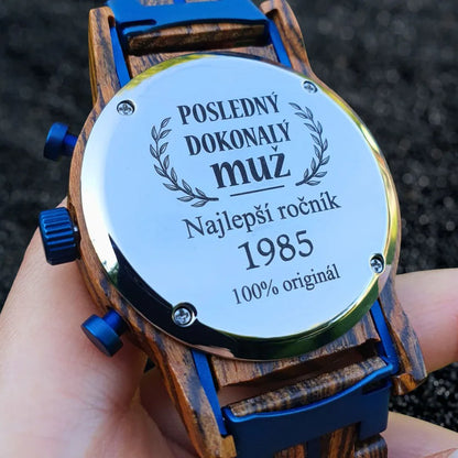 Close-up of personalized wooden wristwatch backplate with Slovak engraving and blue accents