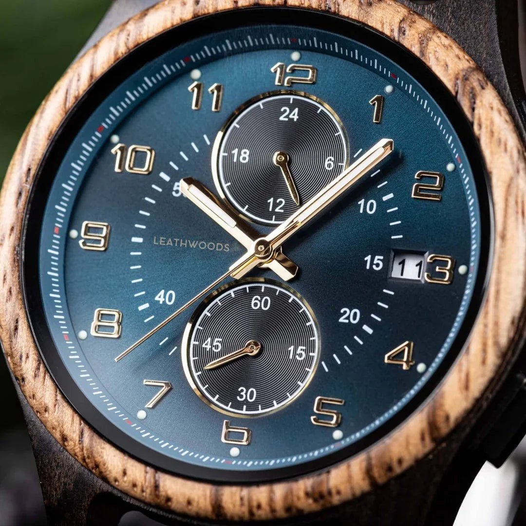Close-up of LEATHWOODS wood bezel chronograph watch with blue face and gold markers