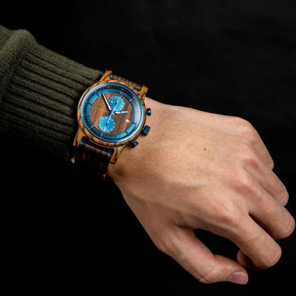 Leathwoods wooden watch with blue dial on wrist against black background