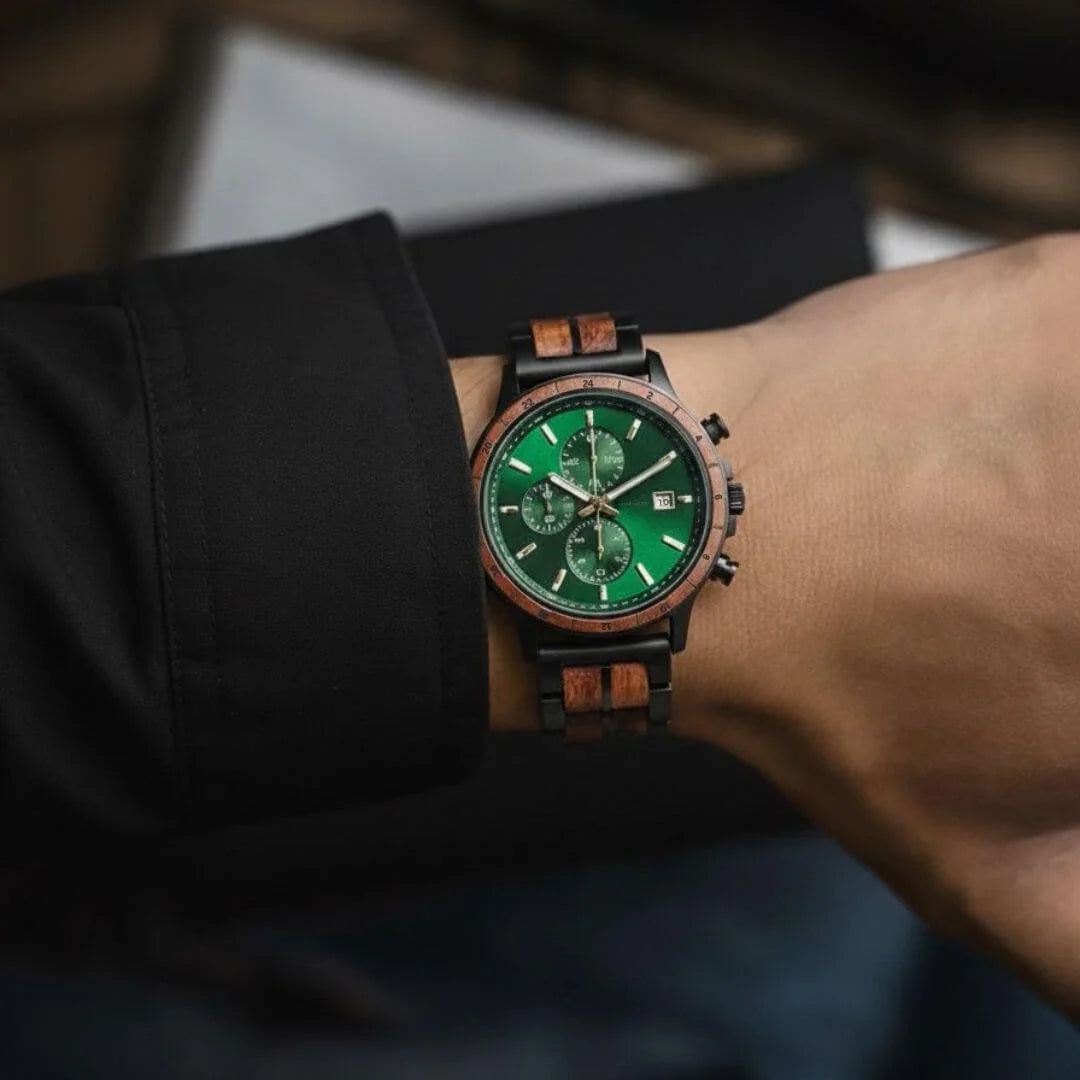 Men's wooden wristwatch with green dial and walnut wood accents on a wrist